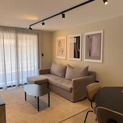 a living room with a couch and a table at Faz Flat in Cordoba