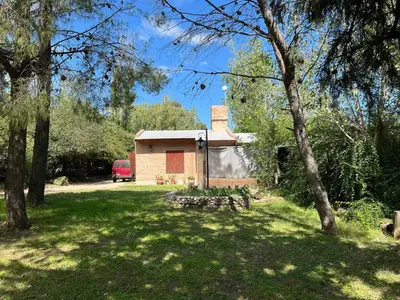 a small house in the middle of a yard at Cabaña Don Licho in San Javier