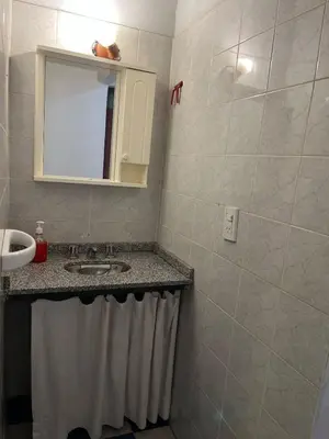 a bathroom with a sink and a mirror at Cabaña Don Licho in San Javier