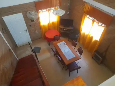 an overhead view of a dining room with a table and chairs at Cabañassoleado Villa Cura Brochero in Villa Cura Brochero