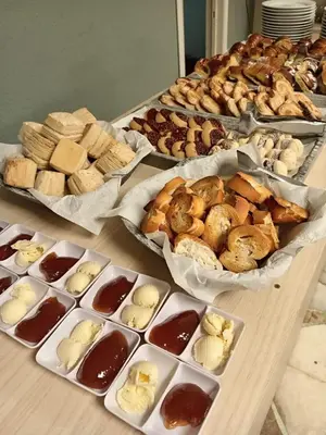 a table topped with different types of pastries and desserts at Brit Hotel in Villa Carlos Paz