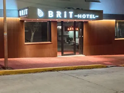 a building with a sign for a britt hotel at Brit Hotel in Villa Carlos Paz