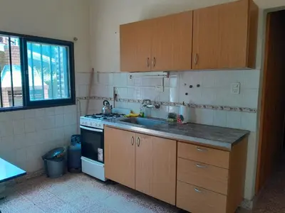 a kitchen with a sink and a stove at La Morada de sus Sueños in Bialet Massé