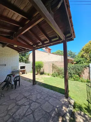 a pavilion with a table and chairs on a patio at Casa Tilo número 1 in Mina Clavero