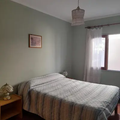 a bedroom with a bed and a window at Departamento centrico Villa Carlos Paz in Villa Carlos Paz