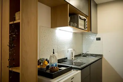 a kitchen with a sink and a microwave at Moderno loft en Güemes in Cordoba