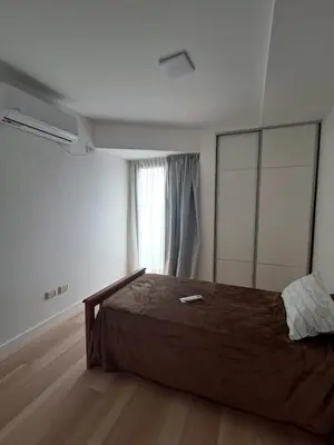 a bedroom with a large bed with a large mirror at Figueroa Alcorta B Centro in Cordoba
