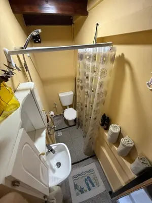 a small bathroom with a toilet and a sink at Departamento zona norte in Cordoba