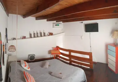 a bedroom with a bed and a tv in it at Departamento zona norte in Cordoba