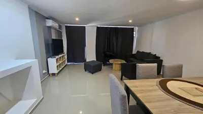 a living room with a couch and a table at Duplex Luxor Calazans in Cordoba