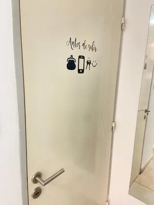 a bathroom door with a sign that reads wishes to stay at LitStay Trejo in Cordoba