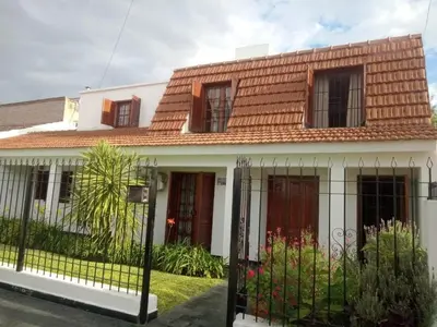 a white house with a red roof at Petunia in Cordoba