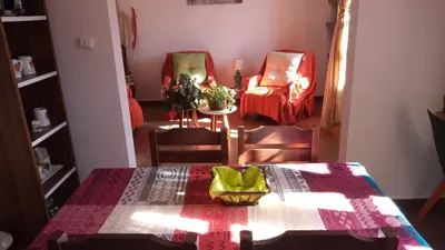 a dining room with a table and two chairs and a room with a tableablish at Petunia in Cordoba