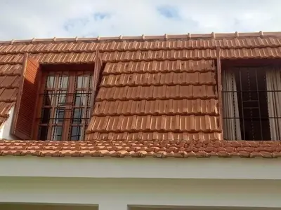 a tile roof with windows on top of a building at Petunia in Cordoba