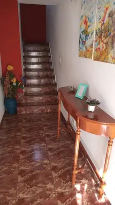 a stairway with a wooden table and a stair case at Petunia in Cordoba