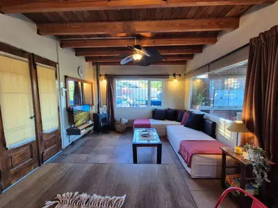a living room with a couch and a table at Casa Serrana Mirador del Lago - Casa con Quincho in Bialet Massé