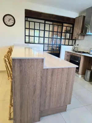 a kitchen with a large island in the middle at Casa a 5 minutos de Villa Carlos Paz in Villa San Nicolás