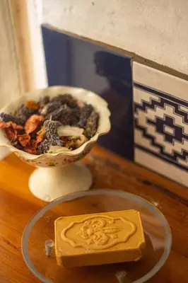 a bar of soap sitting on a table next to a bowl of food at Casita Meraki para 2 personas in Villa Carlos Paz