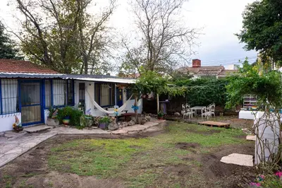 a backyard of a house with a swing at Casita Meraki para 2 personas in Villa Carlos Paz