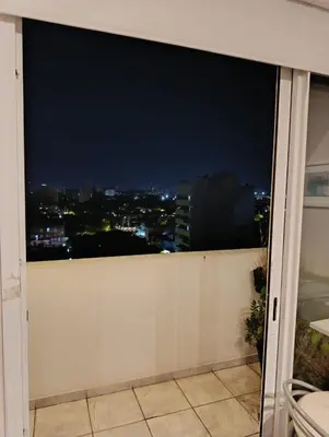 a balcony with a view of a city at night at Luminous department for 2 Ubicado a 10 cuadras de Shopping Nuevocentro in Cordoba