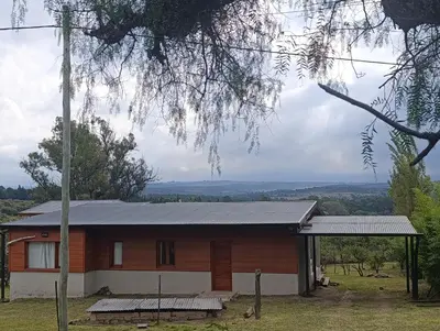 a house with a metal roof at Casa moderna y nueva, vista a las sierras con cercanía al rio in Los Reartes