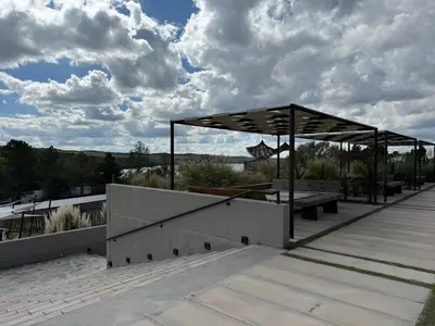 a pavilion with a picnic table and a bench at Graciana Residence H 11 JUNIO reserva mínima 3 noches in Trapiche