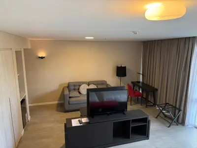a living room with a couch and a television at Graciana Residence H 11 JUNIO reserva mínima 3 noches in Trapiche