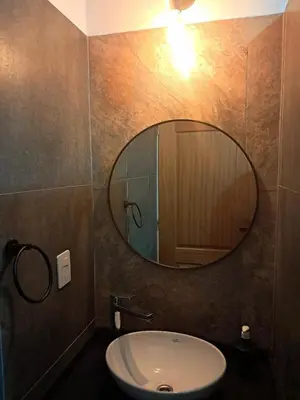 a bathroom with a sink and a mirror on the wall at Terrazas al Golf in Alta Gracia