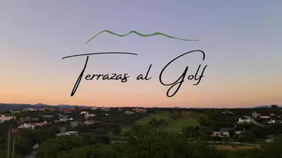 a view of a city at sunset with the words francis all quit at Terrazas al Golf in Alta Gracia