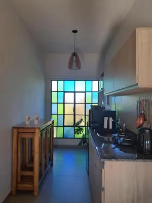a kitchen with a stained glass window in it at Terrazas al Golf in Alta Gracia