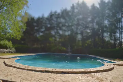 a small swimming pool with a circle around it at Cabañas Altos Del Parque in Villa Ciudad Parque