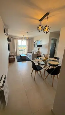 a living room with a table and chairs and a couch at Guesthouse Luxury in Cordoba