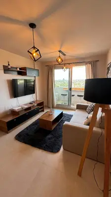 a living room with a couch and a tv at Guesthouse Luxury in Cordoba