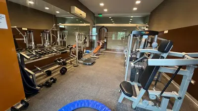 a gym with several tread machines in a room at Guesthouse Luxury in Cordoba