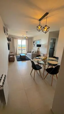 a living room with a table and chairs and a couch at Guesthouse Luxury in Cordoba