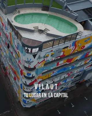 a building with a pool with a sign on it at Moderno y cómodo monoambiente céntrico con amenities y SEGURIDAD 24hs in Cordoba