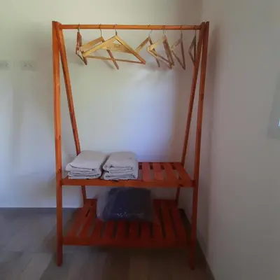 a shelf with two folded towels on a wall at Cabañas Tinkuy II in Cortaderas