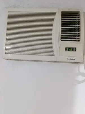 a white toaster oven sitting on a wall at El ROBLE 2 in Cordoba