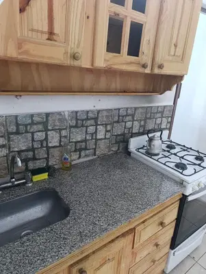 a kitchen counter with a stove and a sink at El ROBLE 2 in Cordoba