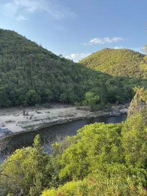 a view of a river with trees and a mountain at Playas Doradas in Villa Anizacate