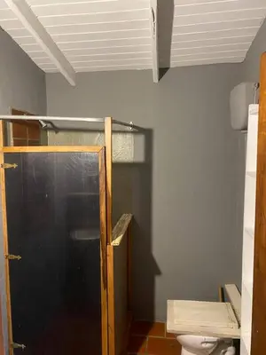 a bathroom with a shower and a toilet at Tierra linda in Las Chacras (La Paz)