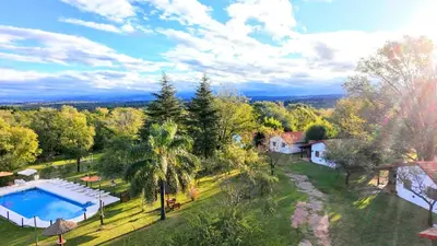 an aerial view of a house with a swimming pool at Lomas de Belgrano Oficial cabaña 1 in Villa General Belgrano