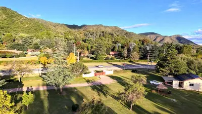 an aerial view of a park with mountains in the background at Lomas de Belgrano Oficial cabaña 1 in Villa General Belgrano