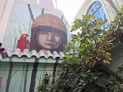 a mural of a woman on the side of a building at Pousada elisa in Cordoba
