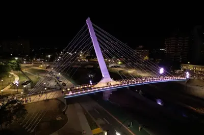 a bridge with lights on it at night at Pousada elisa in Cordoba
