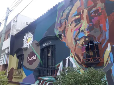 a mural of a donut on the side of a building at Pousada elisa in Cordoba