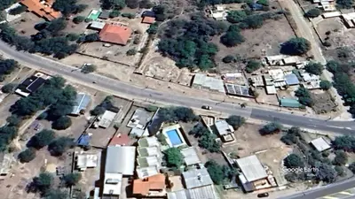 an overhead view of a city with houses and a road at Complejo EL ALTO in Tanti