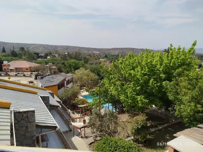 an overhead view of a town with a pool and trees at Complejo EL ALTO in Tanti