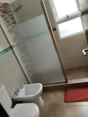 a bathroom with a toilet and a sink at Cabañas Potrero de Garay in La Estancia