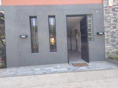 a man standing in front of a building with a door at EnlodelLuly in Villa Carlos Paz